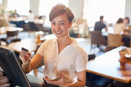 Employee using Heartland POS